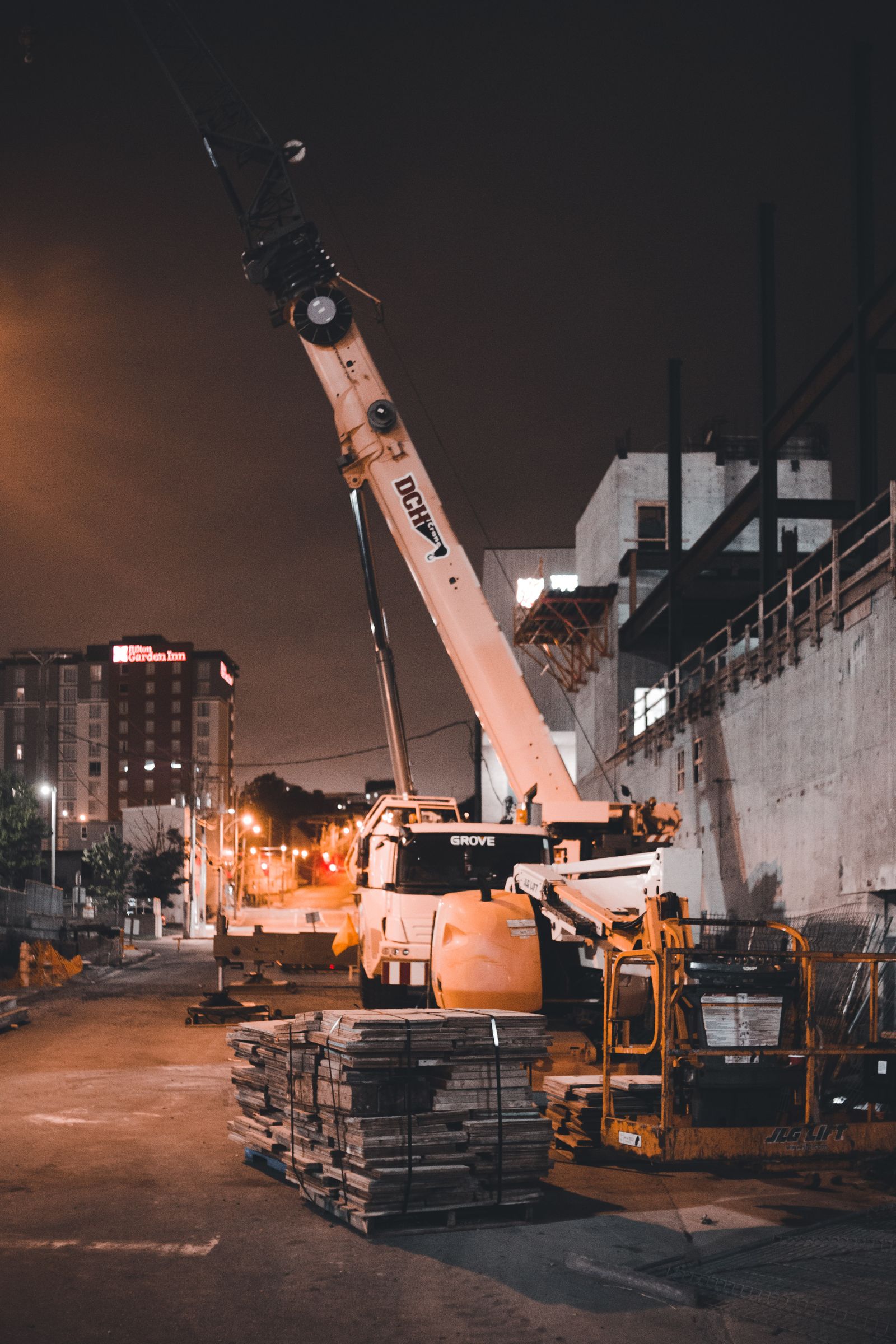 Crane working on a building site in the evening