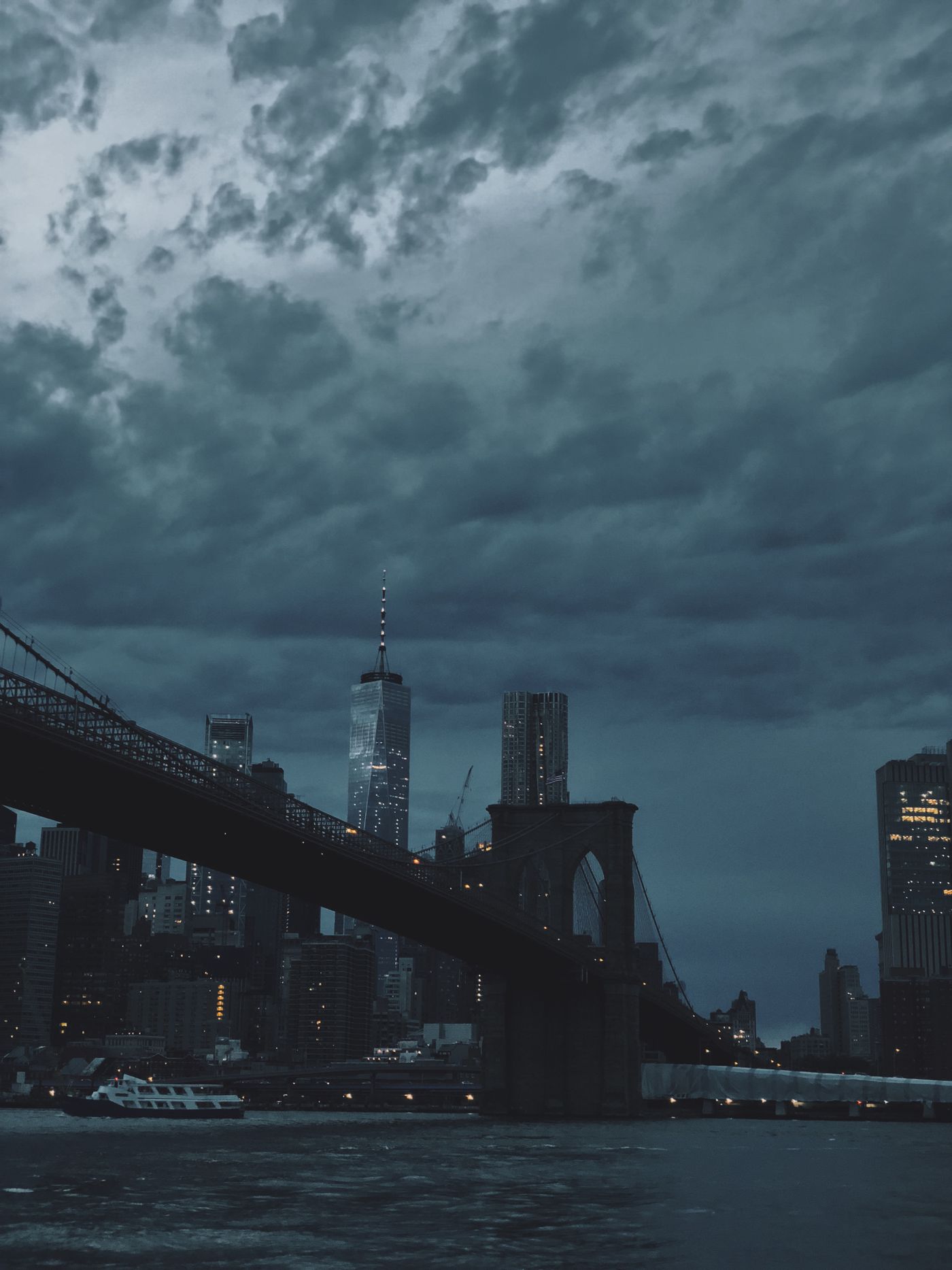 City skyline under heavy cloud at dusk