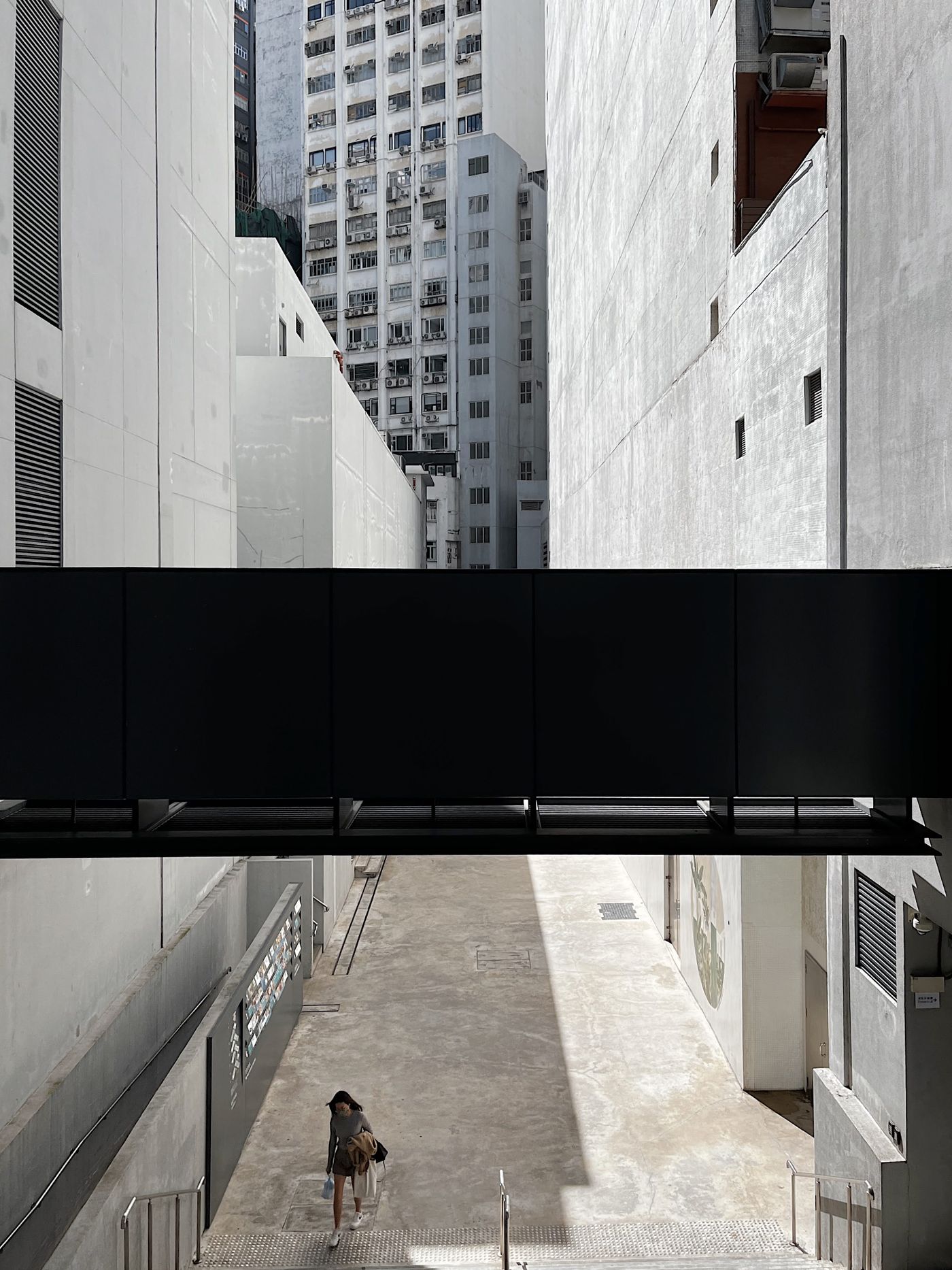 Narrow street between concrete high-rises