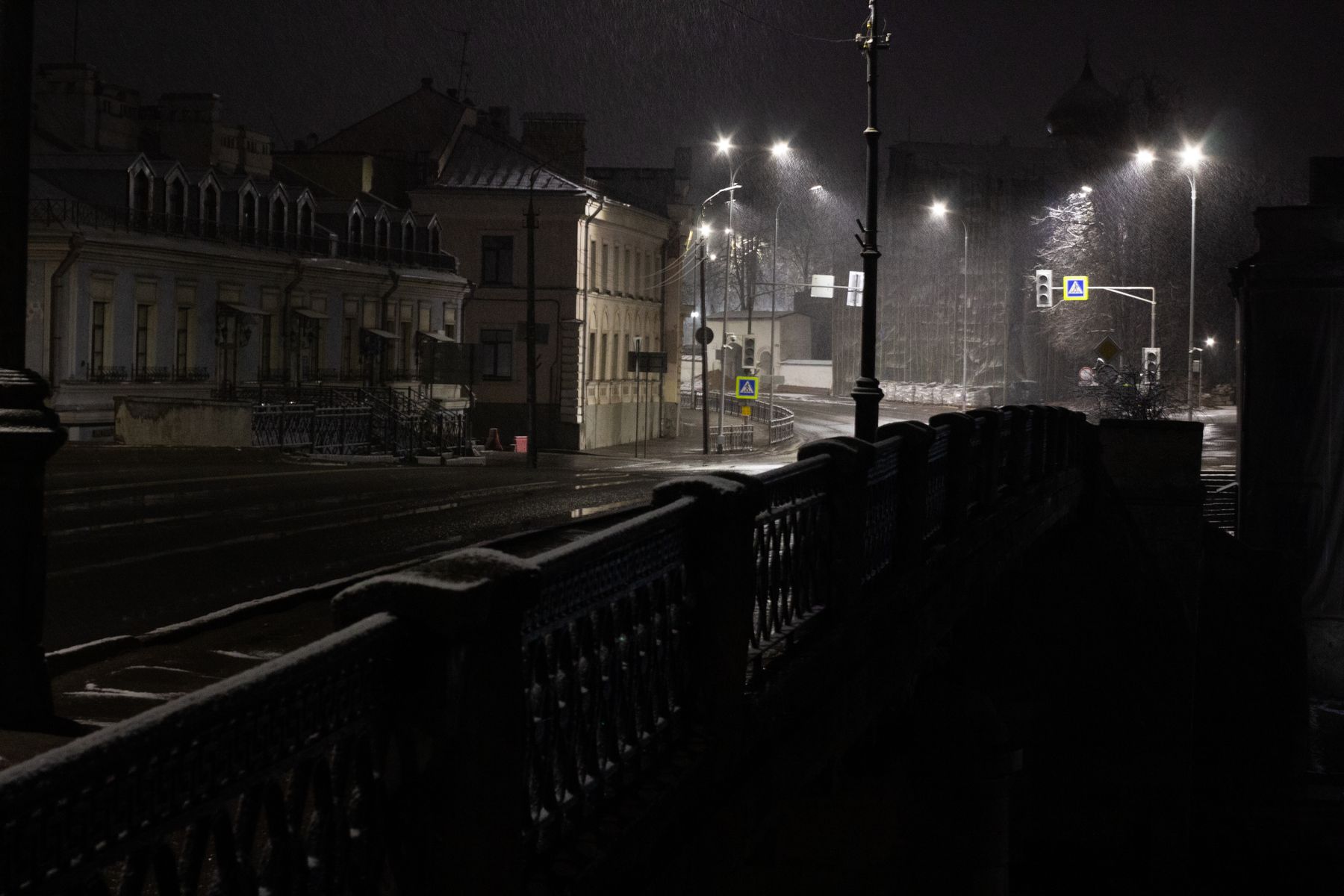 Empty city street at night in the rain